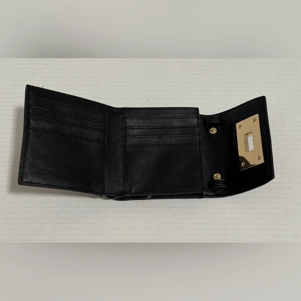 Calvin Klein black trifold wallet with a gold-tone metal closure